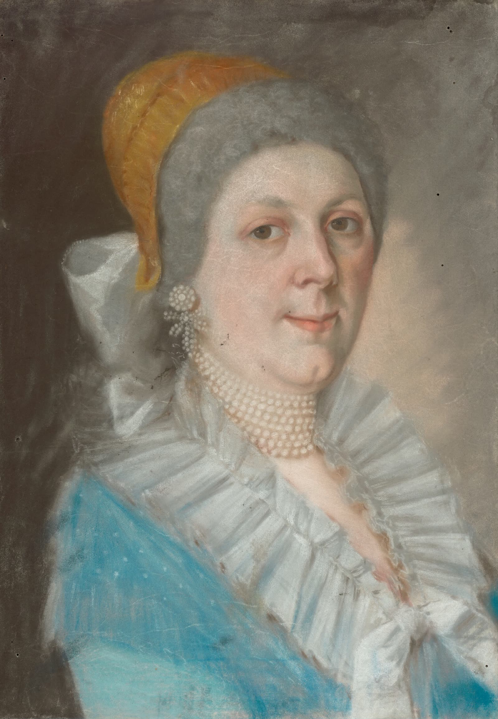 An eighteenth-century portrait of a young woman in a lace cap wearing a pearl necklace